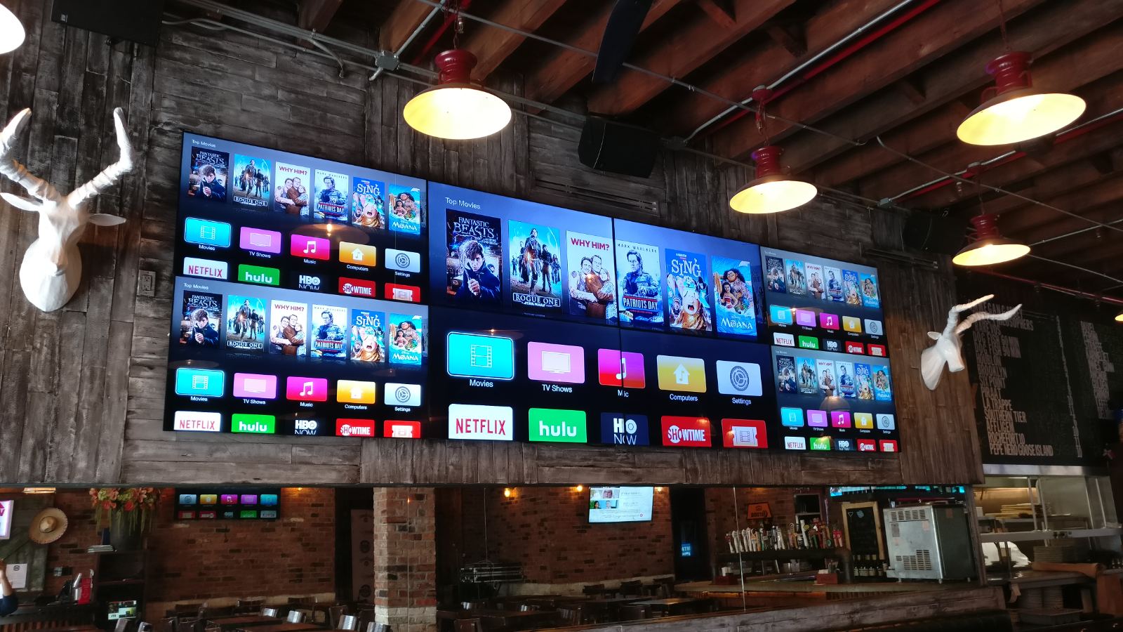 A row of displays mounted above a working bar