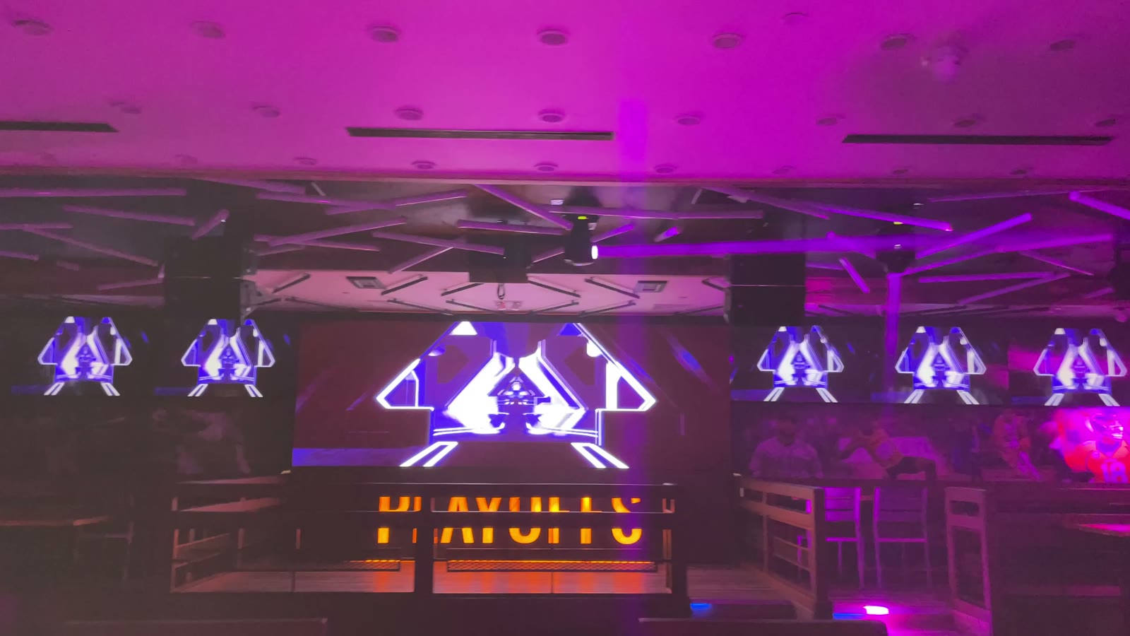 The lounge lit magenta with its playoffs signage running