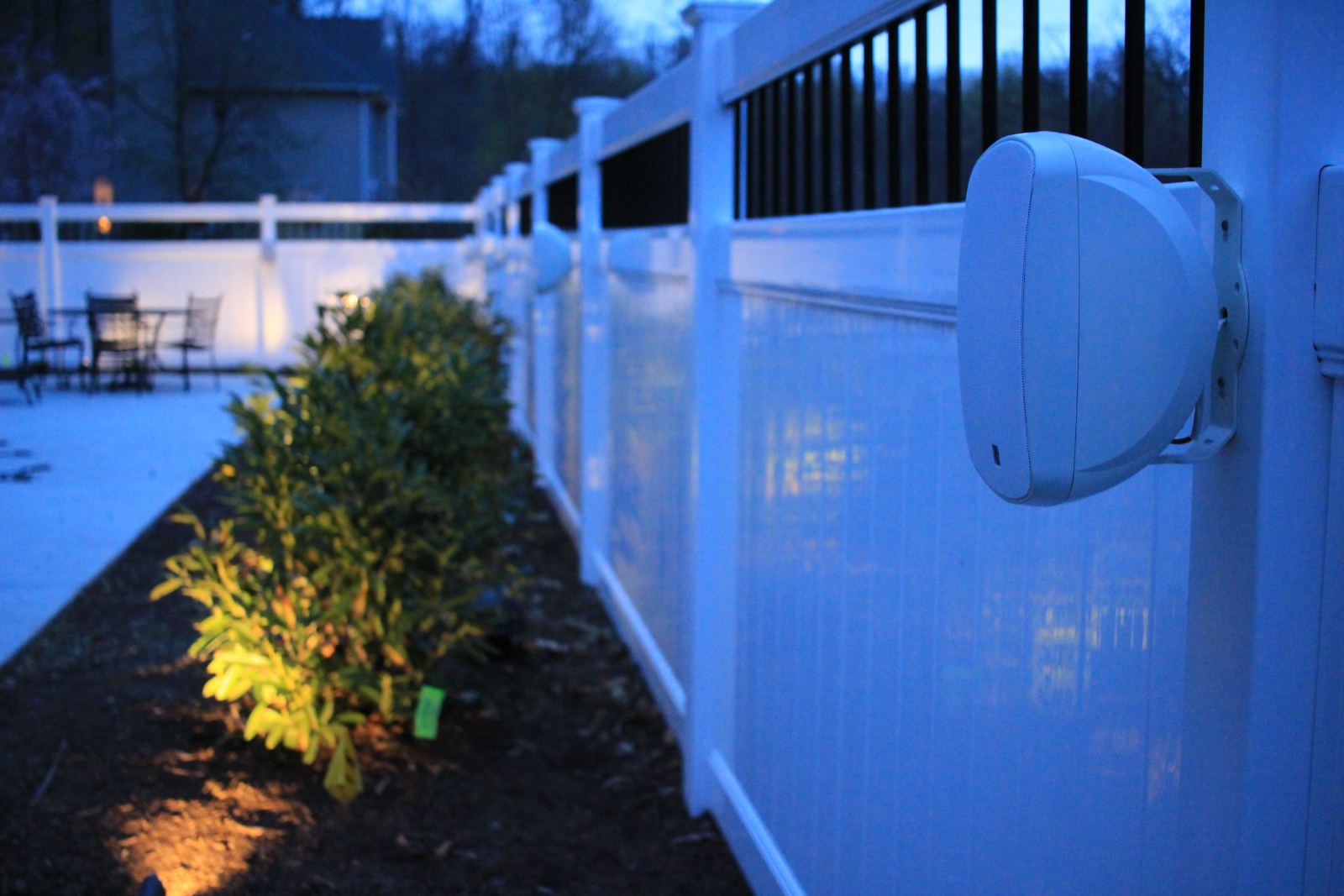 Landscape lighting picking out the planting beds after dark