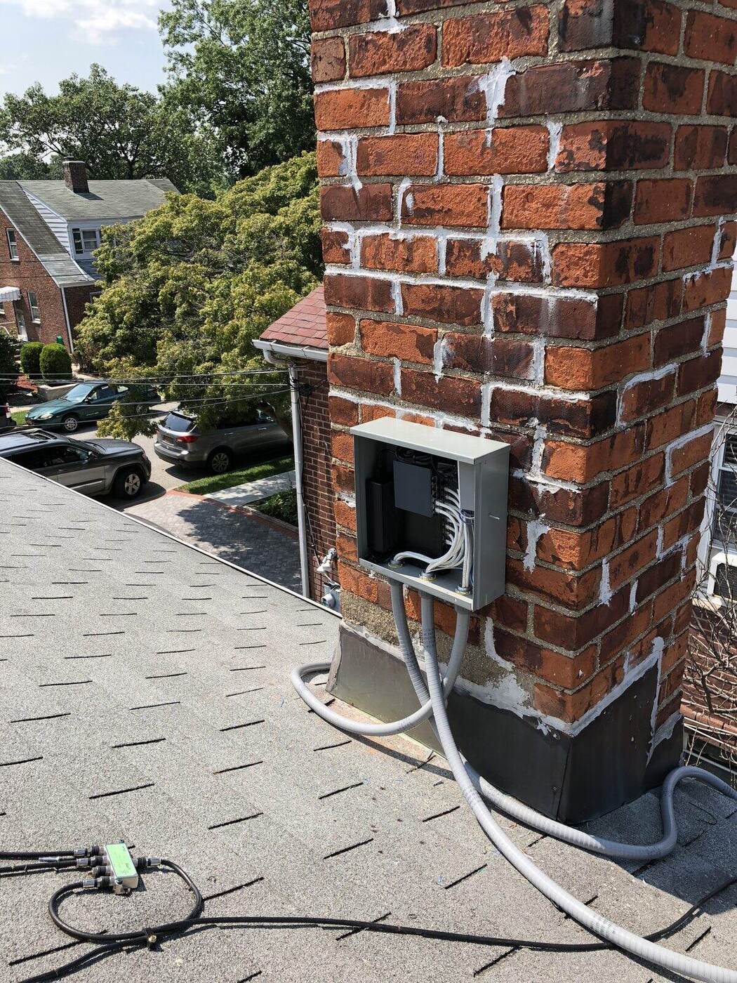 A camera mounted high on the chimney, cabled down the roof